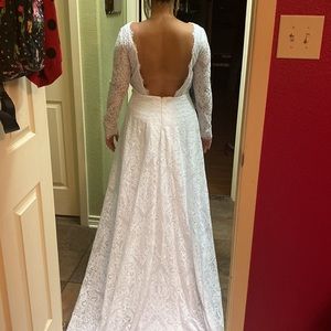 Beautiful white lace wedding gown. No stain or rips.